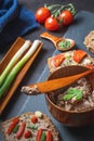 Homemade Rustic Pate on a Bitten Slice of Bread with Fresh Vegetables