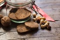 Homemade rustic wholegrain cookies on a wooden table with jar and decoration