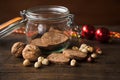 Homemade rustic wholegrain cookies on a wooden table with jar and decoration