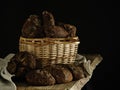 Homemade rye bread in a basket on a dark background. Royalty Free Stock Photo