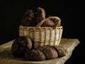 Homemade rye bread in a basket on a dark background. Royalty Free Stock Photo