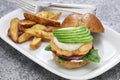 Homemade salmon burger with avocado Royalty Free Stock Photo