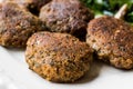 Homemade Salmon Meatballs Served with Orange Salad.