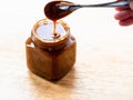 Homemade salted butter caramel sauce in glass jar Royalty Free Stock Photo