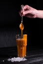 Homemade salted caramel sauce in a jar on a dark background. copy space text Royalty Free Stock Photo