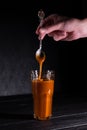 Homemade salted caramel sauce in a jar on a dark background. copy space text Royalty Free Stock Photo