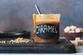 Homemade salted caramel sauce in jar Royalty Free Stock Photo