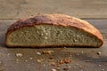 Homemade white bread with brown salty wet crust, cut in half