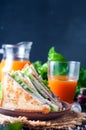 Homemade sandwich with salad and juice as a healthy breakfast Royalty Free Stock Photo