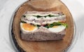 Homemade sandwich stuffed with chicken breast, cheese, boiled eggs and fresh vegetables Royalty Free Stock Photo
