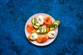 Homemade sandwiches with french baguette, salmon, cheese and vegetable on blue background top view mock-up