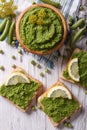 Homemade sandwiches with green peas close-up. vertical top view Royalty Free Stock Photo