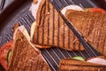 Homemade sandwiches lie on the groa grill