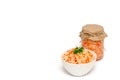 Homemade sauerkraut with carrot in white ceramic bowl and a glass jar on white background. Fermented food. Copy space Royalty Free Stock Photo