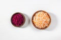 Homemade sauerkraut. Fermented food. Sauerkraut with carrots and beets in a wooden bowl on a white background Royalty Free Stock Photo