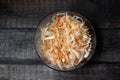 Homemade sauerkraut. Fermented food. Sauerkraut with carrots in a bowl on a wooden background. Top view, flat lay. Copy space Royalty Free Stock Photo