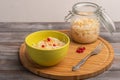 Homemade sauerkraut in a jar with a salad bowl and a fork on a wooden board. Rustic style Royalty Free Stock Photo