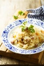 Homemade sauerkraut stew with smoked meat and parsley