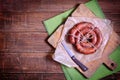 Homemade Sausage Roll on the wooden board. Royalty Free Stock Photo