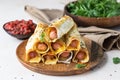 Homemade sausages in dough with sesame served with tomato sauce, light stone background. Pigs in blanket. Fast food Royalty Free Stock Photo