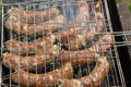 Homemade sausages grilled on a barbecue closeup Royalty Free Stock Photo