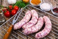 Homemade sausages in a natural shell with spices on grill Royalty Free Stock Photo