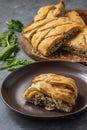 Homemade savory braided puff pastry with spinach and ricotta filling.