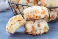 Homemade savory cookies with cheese and bacon in a basket and on table, horizontal Royalty Free Stock Photo