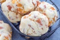 Homemade savory cookies with cheese and bacon in a basket and on table, horizontal Royalty Free Stock Photo