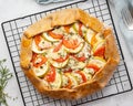 Homemade savory galette with vegetables, wholegrain pie with tomatoes, zucchini, blue cheese