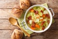 Homemade savoy cabbage soup with fried bacon served with bread close-up in a bowl. Horizontal top view Royalty Free Stock Photo