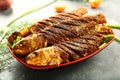 Homemade seafood ,fried fish with exotic spices Royalty Free Stock Photo