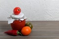 Homemade seasonal preparations. In glass jars, tomato paste. The neck of the cans is wrapped in paper and tied with rope. Nearby