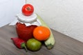 Homemade seasonal preparations. In glass jars, tomato paste. The neck of the cans is wrapped in paper and tied with rope. Nearby