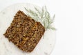 Homemade seed and nut loaf on whit background. Royalty Free Stock Photo