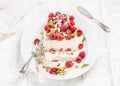 Homemade semifreddo with pistachio, raspberries and mint leaves