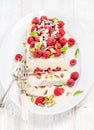 Homemade semifreddo with pistachio, raspberries and mint leaves