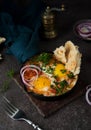 Homemade shakshuka with vegetables on a dark background