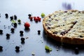 Homemade shortbread berry pie with a slice cut off. Summer receipts