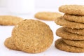 Homemade shortbread cookies made of oatmeal are stacked on a white table background. Food snack concept and with copy space for Royalty Free Stock Photo