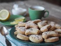 Homemade shortbread cookies sprinkled with sugar with black sesame seeds on a wooden rustic table. Tea party with cookies and Royalty Free Stock Photo