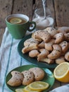 Homemade shortbread cookies sprinkled with sugar with black sesame seeds on a wooden rustic table. Tea party with cookies and Royalty Free Stock Photo