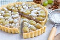 Homemade shortbread dough grape tart with walnut praline, horizontal
