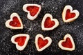 Homemade shortbread heart cookies on black background. Royalty Free Stock Photo
