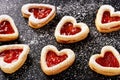 Homemade shortbread heart cookies on black background. Royalty Free Stock Photo