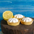 Homemade shortbread mini tart cakes with lemon curd and whipped cream,white grey concrete background copy space Royalty Free Stock Photo