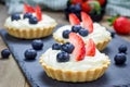 Homemade shortbread tartlets with custard cream, strawberry and blueberry Royalty Free Stock Photo