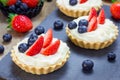 Homemade shortbread tartlets with custard cream, strawberry and blueberry Royalty Free Stock Photo