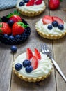 Homemade shortbread tartlets with custard cream, strawberry and blueberry Royalty Free Stock Photo