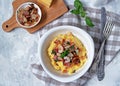 Homemade shrimp and grits with bacon, Chedder cheese and parsley in a white bowl. American cuisine